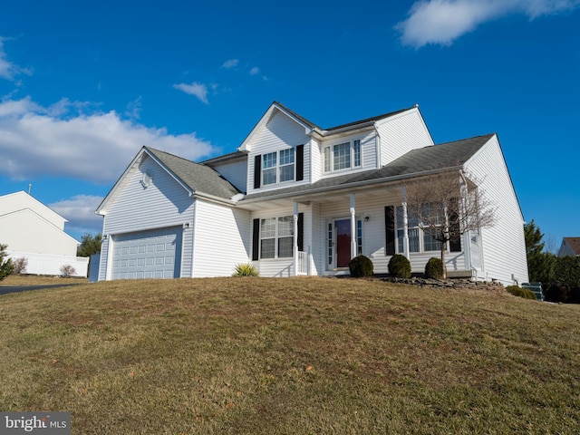 view of front of home featuring a garage, a porch, and a front yard