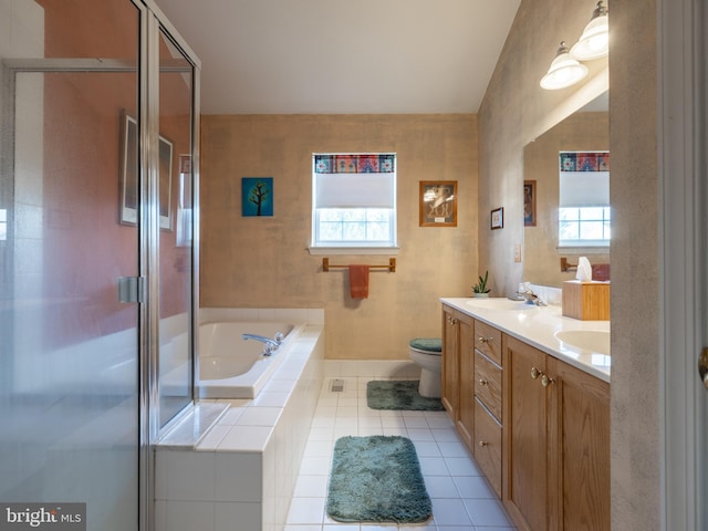 full bathroom featuring tile patterned floors, vanity, toilet, and a healthy amount of sunlight