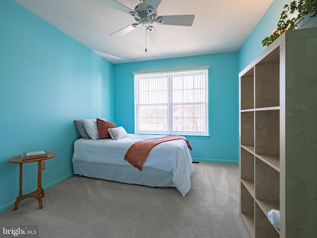 carpeted bedroom featuring ceiling fan