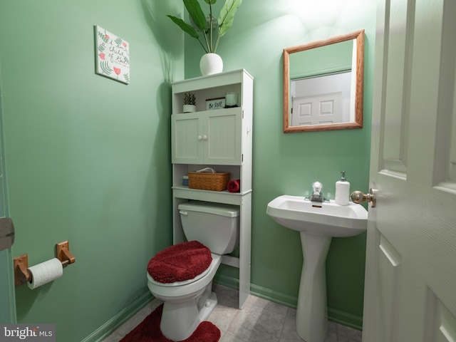 bathroom featuring sink and toilet