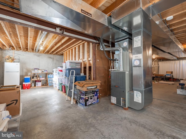 basement with white fridge