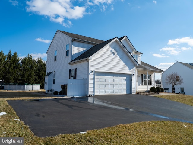 view of side of property featuring a garage