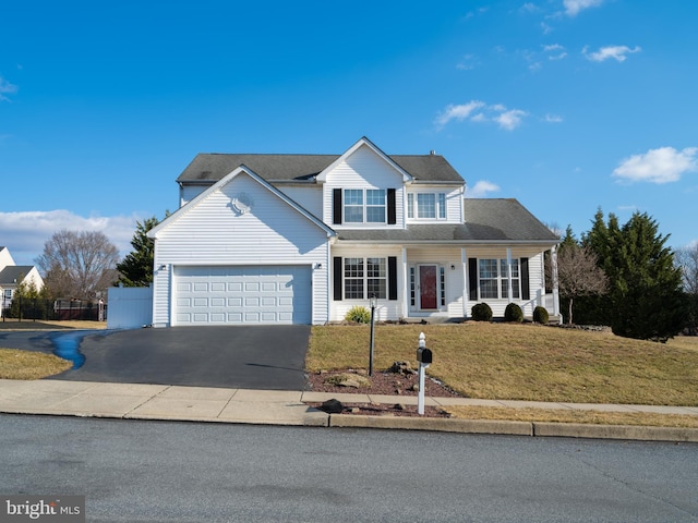 view of front property with a garage and a front yard