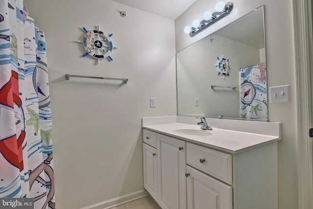 bathroom with tile patterned floors and vanity