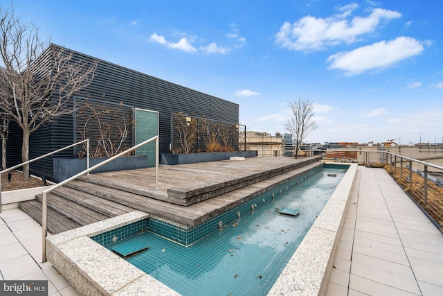 view of swimming pool with a fenced in pool