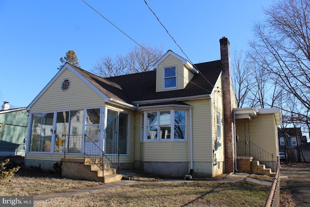 view of front facade featuring a sunroom