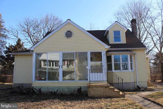 view of front of house featuring a sunroom