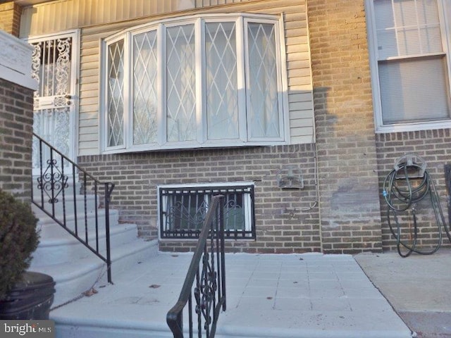 doorway to property featuring a patio area