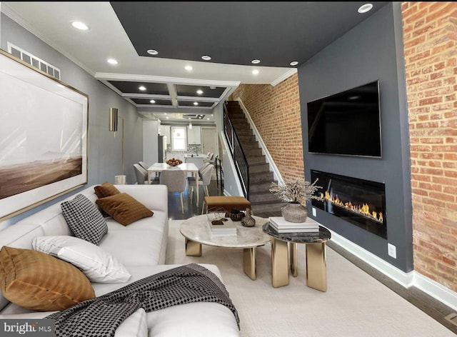 interior space featuring coffered ceiling, beam ceiling, ornamental molding, and brick wall