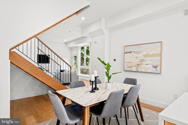 dining space featuring hardwood / wood-style floors