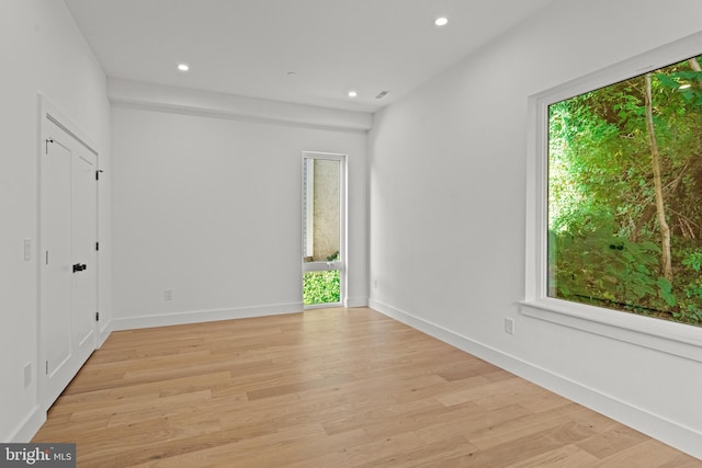 spare room featuring light hardwood / wood-style floors