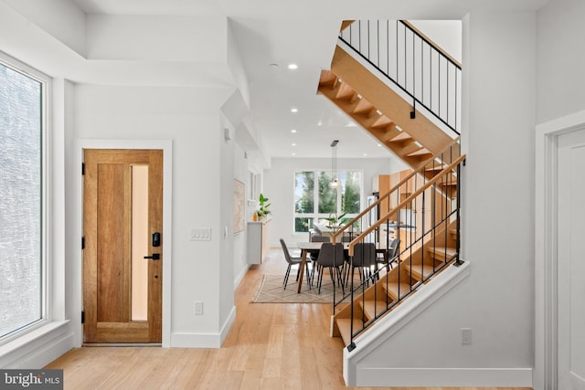 foyer with light hardwood / wood-style floors