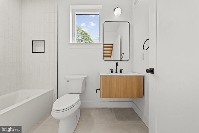 full bathroom featuring tiled shower / bath, vanity, toilet, and tile patterned flooring