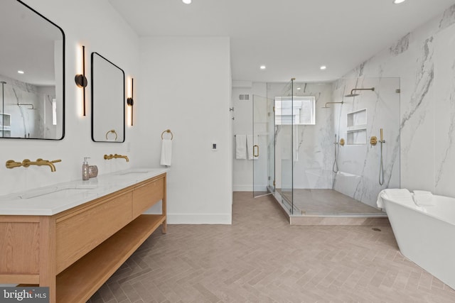 bathroom featuring vanity and shower with separate bathtub