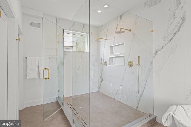 bathroom with a shower with shower door