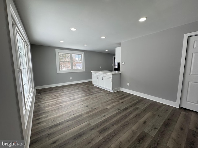 empty room with dark hardwood / wood-style floors