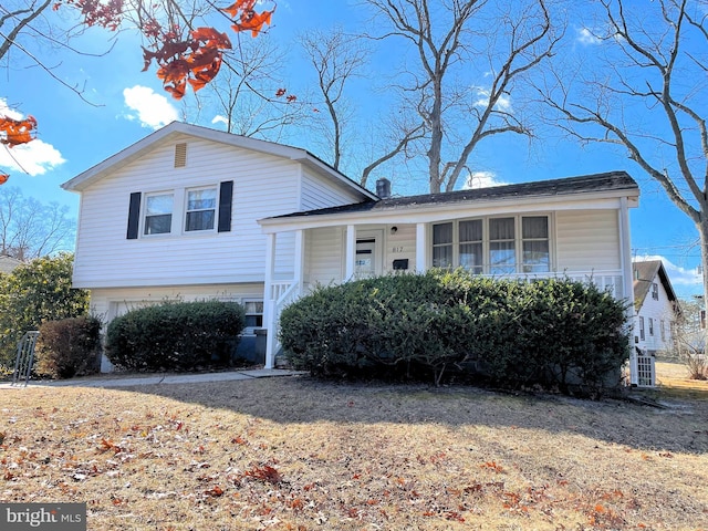 split level home with covered porch