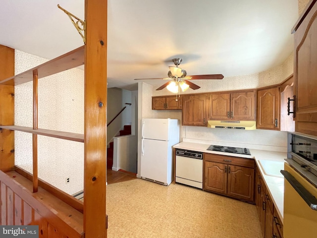 kitchen featuring sink, white appliances, and ceiling fan