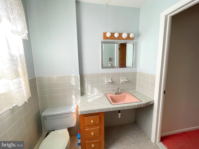 bathroom with sink and toilet