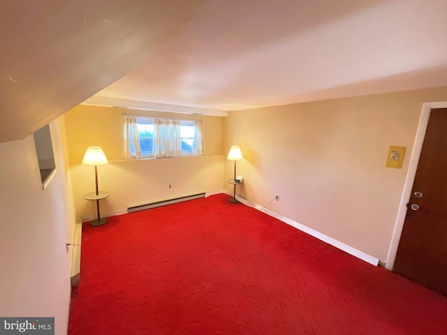 additional living space with vaulted ceiling, carpet floors, and a baseboard radiator