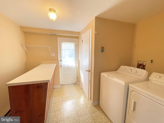 laundry room featuring washing machine and clothes dryer