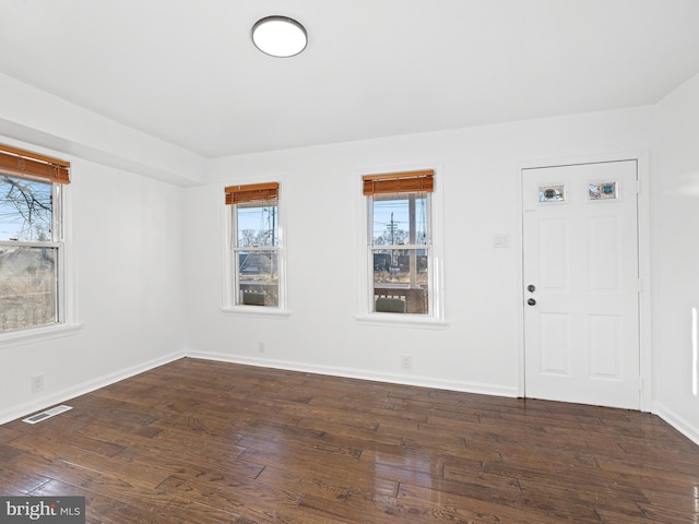 empty room featuring dark hardwood / wood-style floors