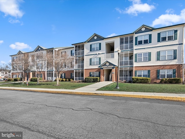 multi unit property featuring brick siding