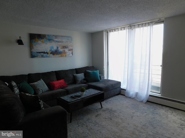 living room featuring a textured ceiling, light colored carpet, and a baseboard radiator