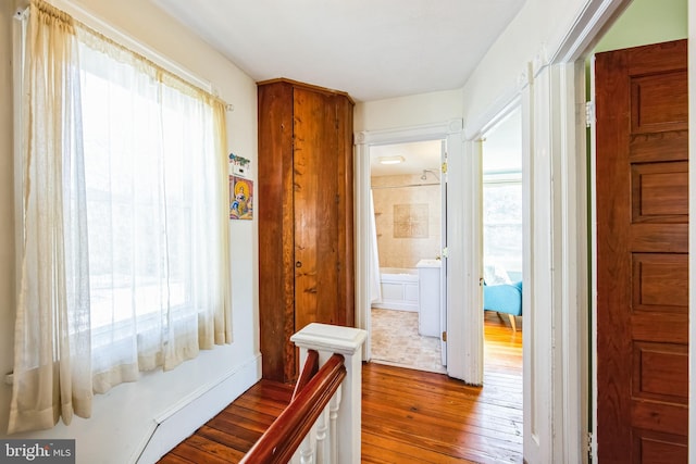 corridor with wood-type flooring