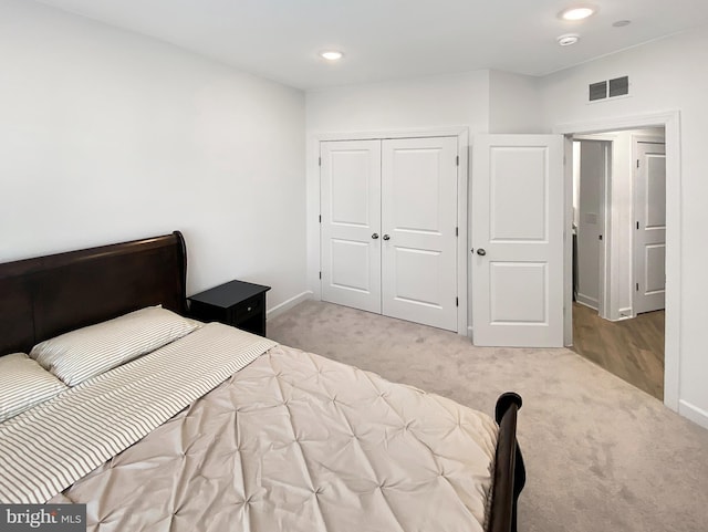 unfurnished bedroom with carpet, visible vents, baseboards, and recessed lighting