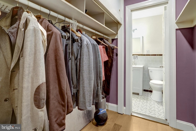 interior space featuring sink and light hardwood / wood-style flooring