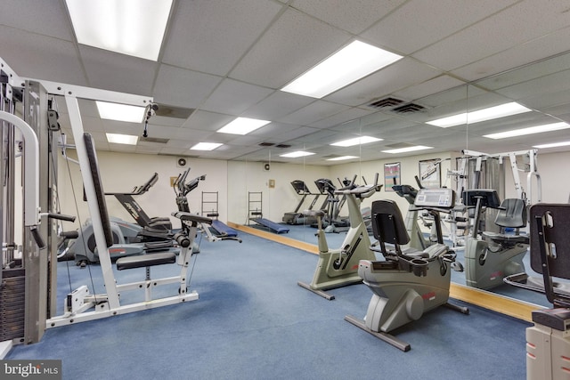 gym featuring a paneled ceiling