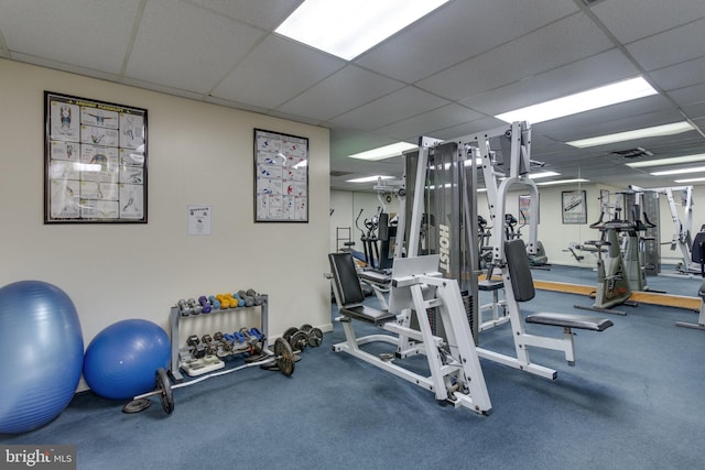 gym featuring a paneled ceiling