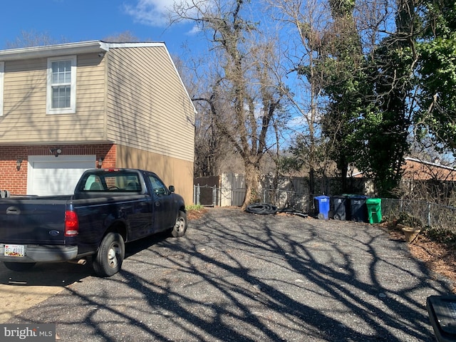 view of side of property with a garage