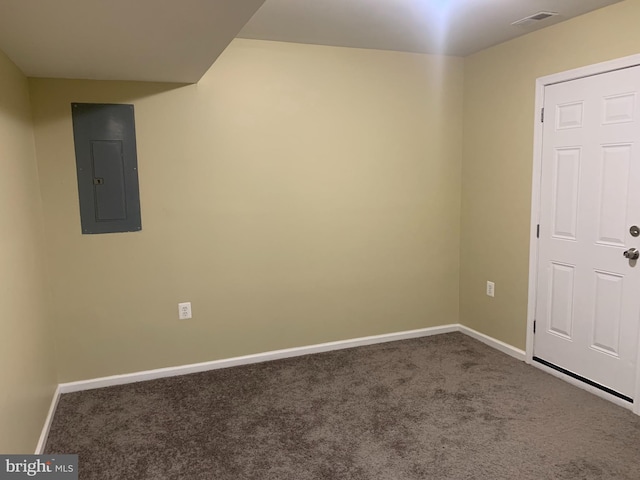 carpeted empty room featuring electric panel