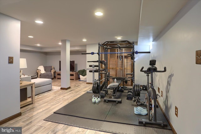 exercise area with light wood-type flooring