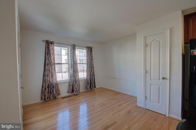 empty room featuring light hardwood / wood-style floors