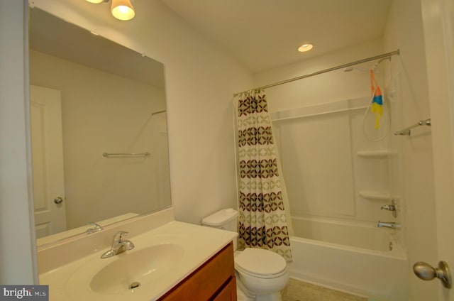 full bathroom with vanity, shower / tub combo with curtain, and toilet