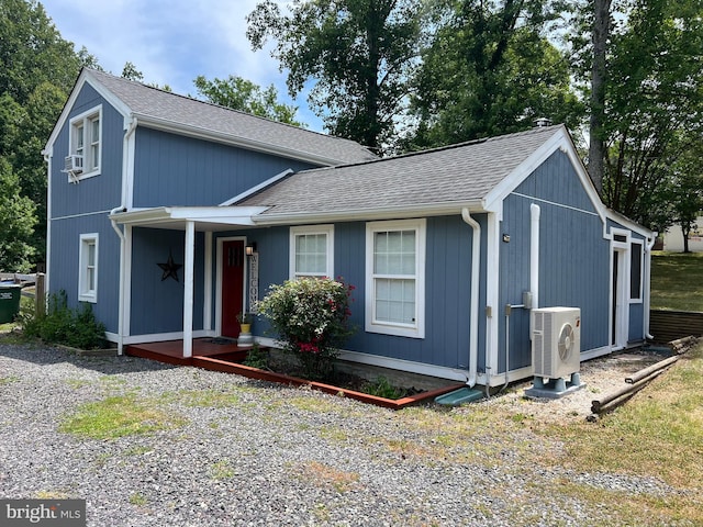 view of front of property featuring ac unit