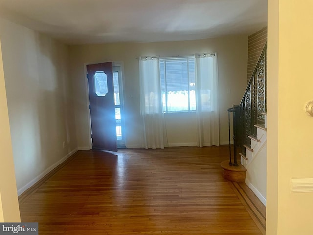 entryway with hardwood / wood-style flooring