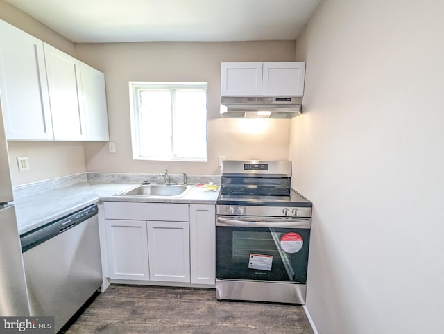 kitchen featuring sink, dark hardwood / wood-style floors, white cabinets, and appliances with stainless steel finishes