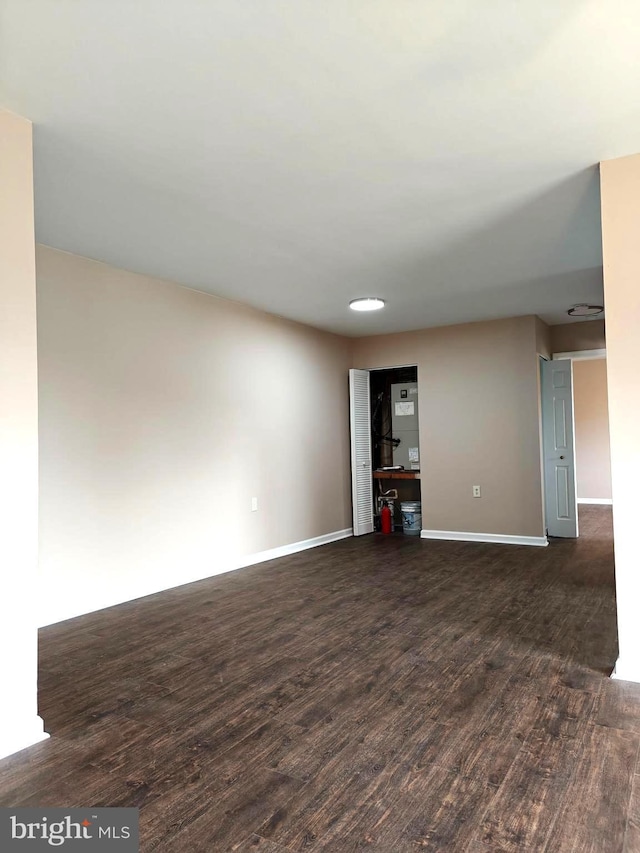 unfurnished room featuring dark hardwood / wood-style floors