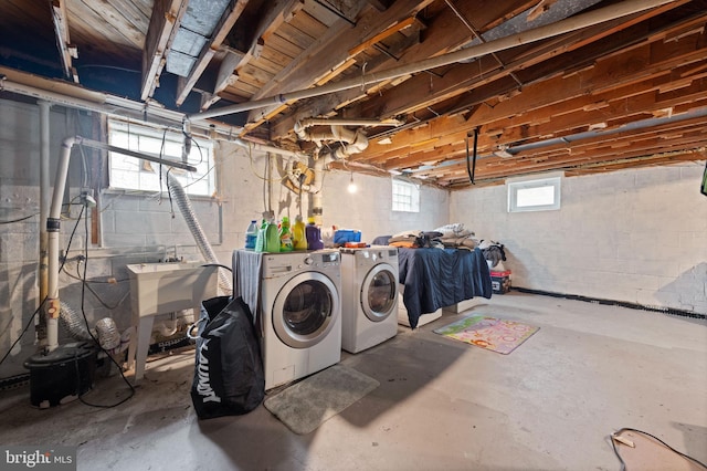 below grade area with washing machine and clothes dryer