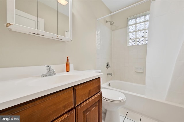 full bathroom featuring tile patterned floors, bathing tub / shower combination, toilet, and vanity