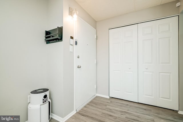 interior space with light wood-type flooring and baseboards