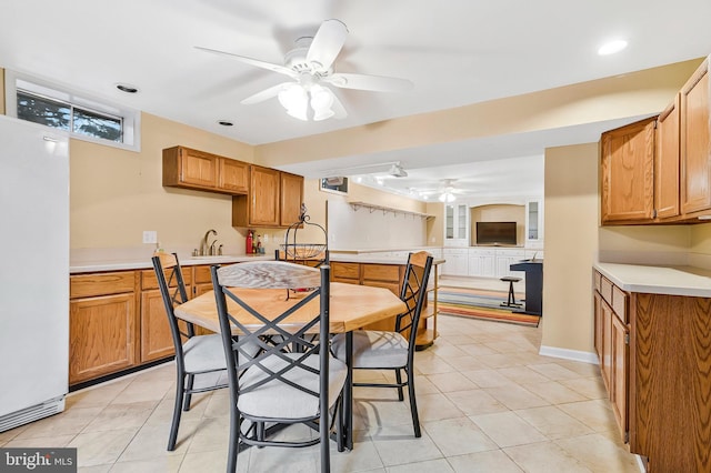 dining room featuring ceiling fan and light tile patterned floors