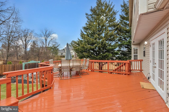 deck featuring fence and outdoor dining space