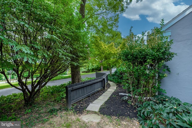 view of home's community with fence