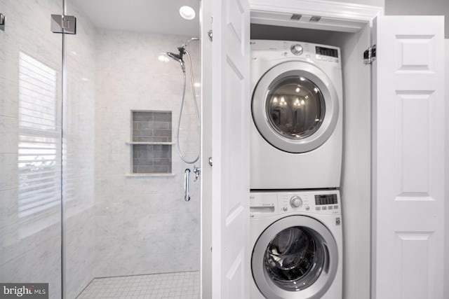 laundry room with laundry area and stacked washer / drying machine
