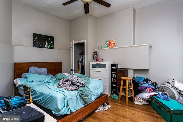 bedroom with ceiling fan and light wood-type flooring